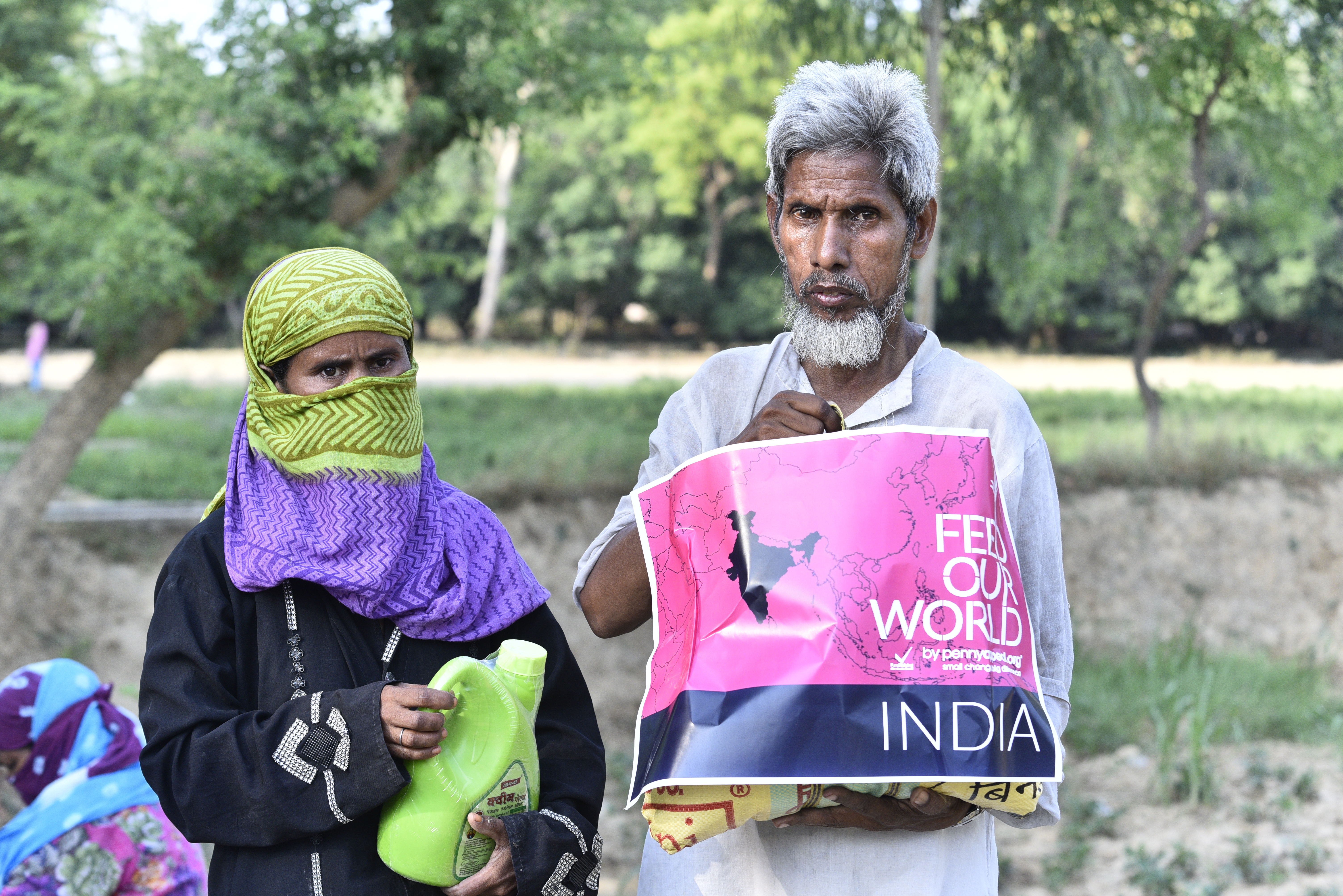 Khadeejah and Mohammed in Mawai, India after having received their culturally-sensitive food pack to provide them meals during the month of fasting, Ramadan.
