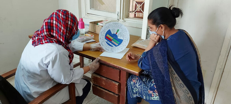 Community Health Worker discusses contraceptive methods with a client.
