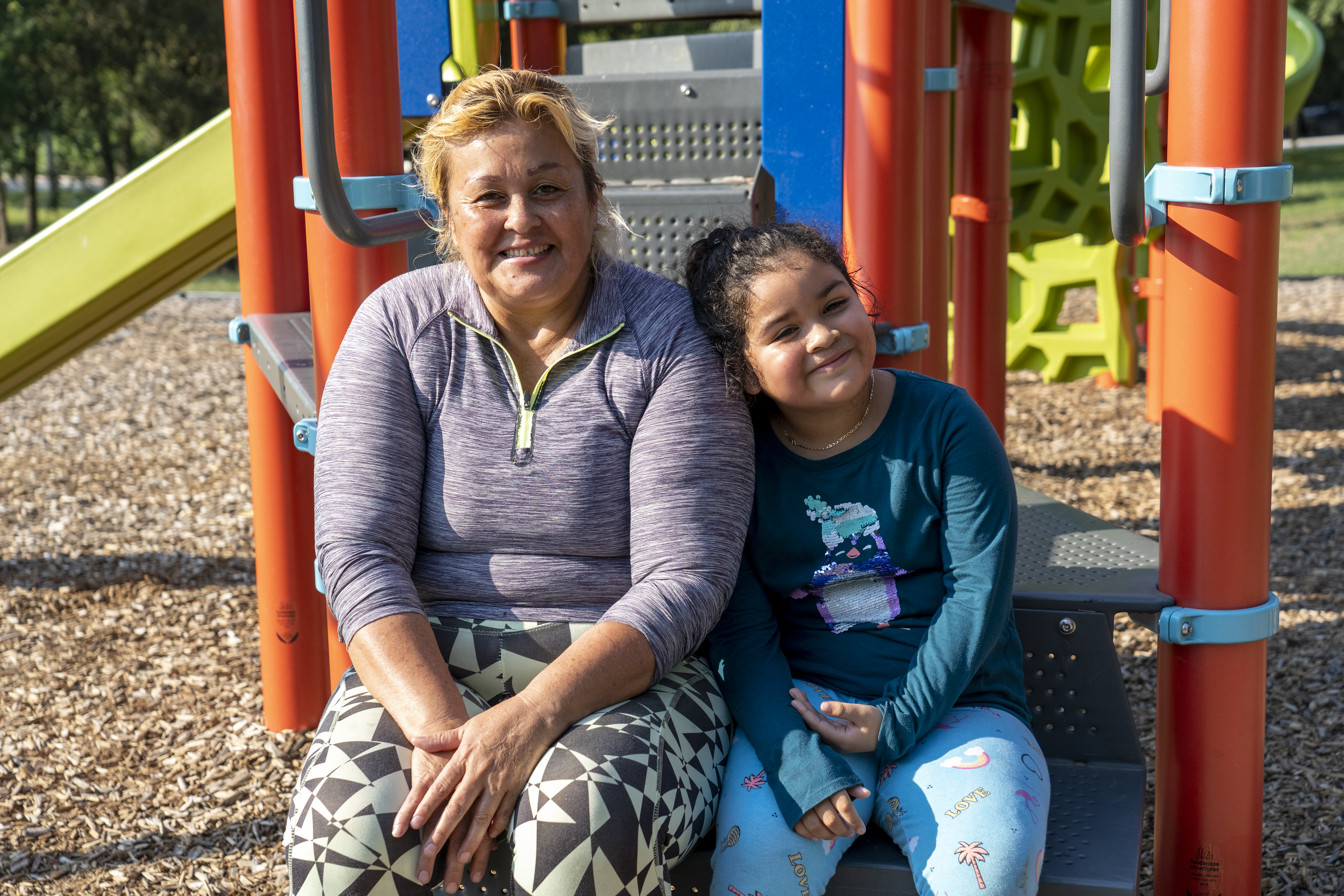 Ana stops by the park with her granddaughter Daniela after picking up food from a Central Texas Food Bank distribution.