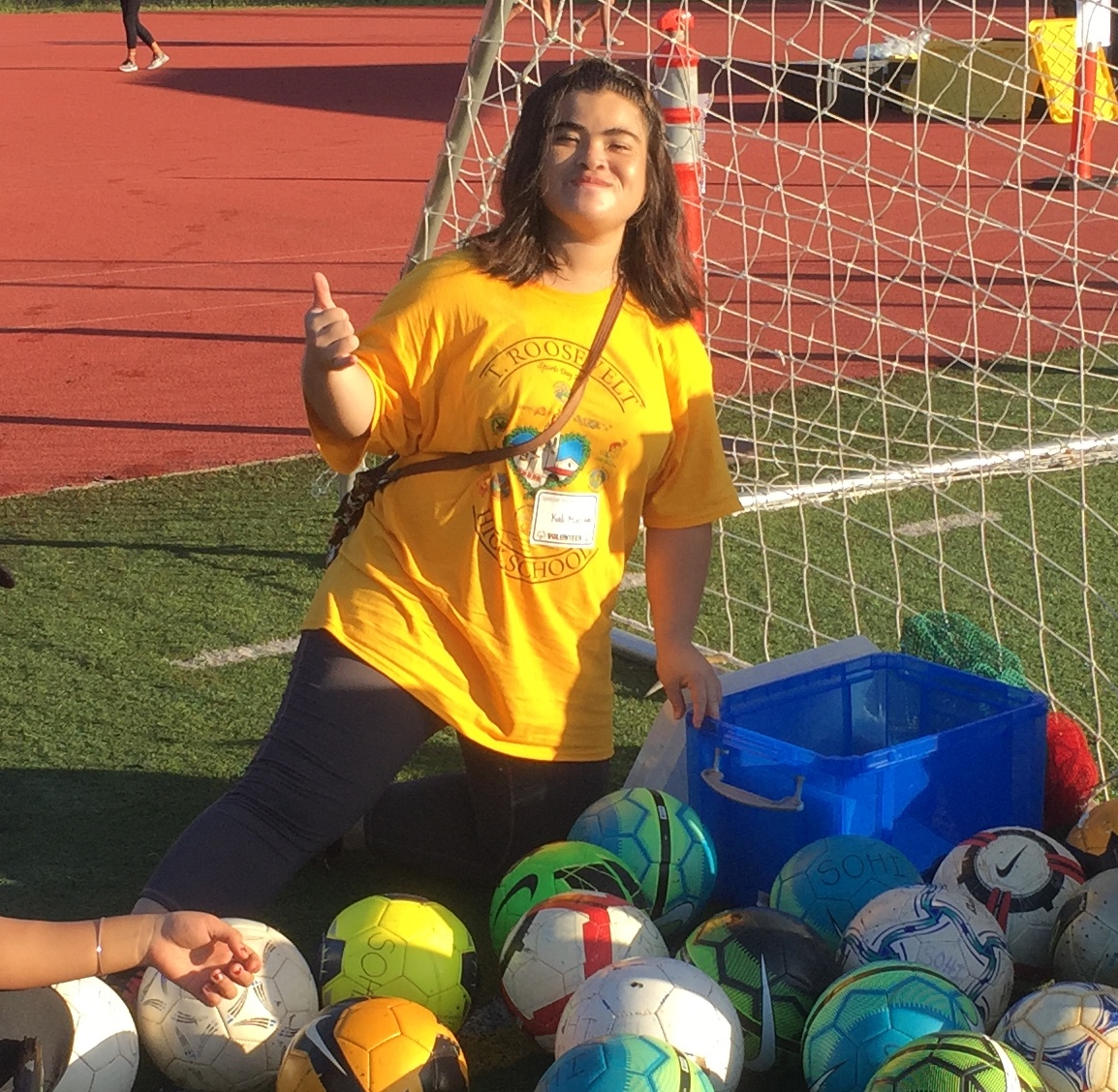 Special Olympics Hawaii athlete, Kaili, show her confidence as she volunteers at a Special Olympics event for preschoolers hosted by her high school.