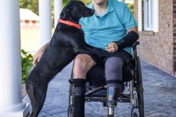 Warrior Jason Ehrhart with his service dog Freedom