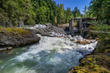 Construction crews remove the Middle Fork Nooksack Dam near Bellingham, Washington, in 2020 to save endangered salmon and orcas.