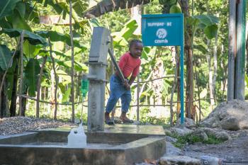 Water pump in Haiti provides clean, convenient access to water for an entire community.