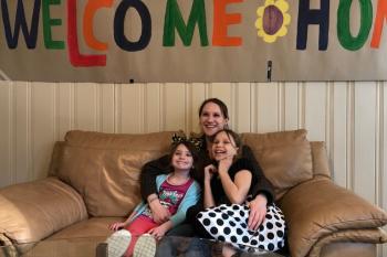 Brittani Salyers and her daughters, Ali and Felicity, are welcomed into their new home in Currituck County.
