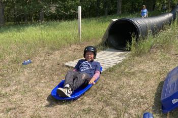Remember the Olympic Luge? Cub Scouts call it sliding down the Black Hole!