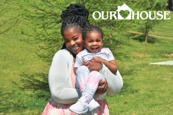 Our House clients Zandra and Zy'Unique smile during a family photoshoot on the Our House campus