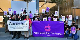 Protestors rallied to urge Apple to abandon its program and commit to protecting user privacy and security.